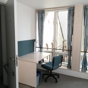 A picture of the desk and windows in one of the new accessible study-bedrooms in the Catherine Hughes Building
