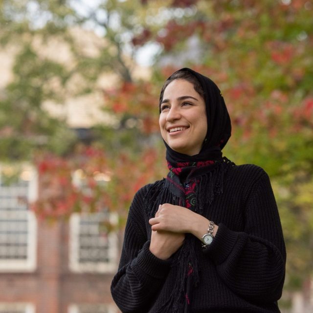 Student smiling in college garden - Malak Alshaikhali