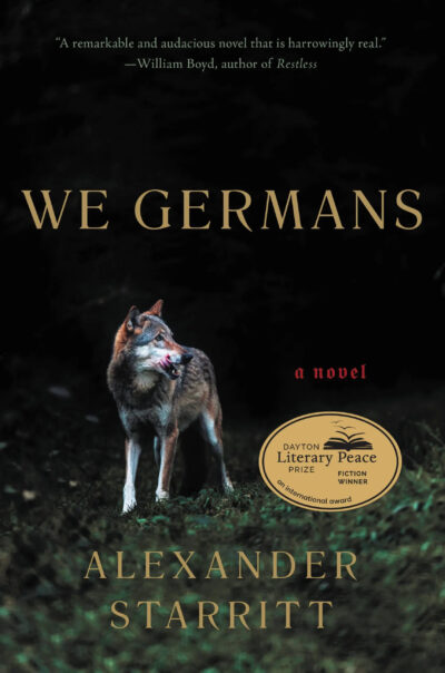 The cover of Alex's novel 'We Germans', showing the title in capital letters against a dark night sky. In the foreground, a wolf stands on a hill facing the viewer and looks off to the right of the cover.