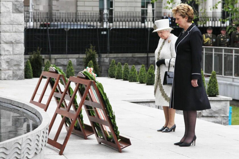 The Queen lays flowers in Dublin's Garden of Remembrance alongside then-Irish President Mary McAleese, 2011.