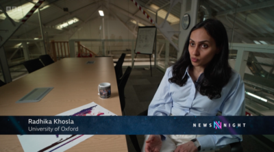 Professor Radhika Khosla speaking on Newsnight from a mezzanine at the Smith School