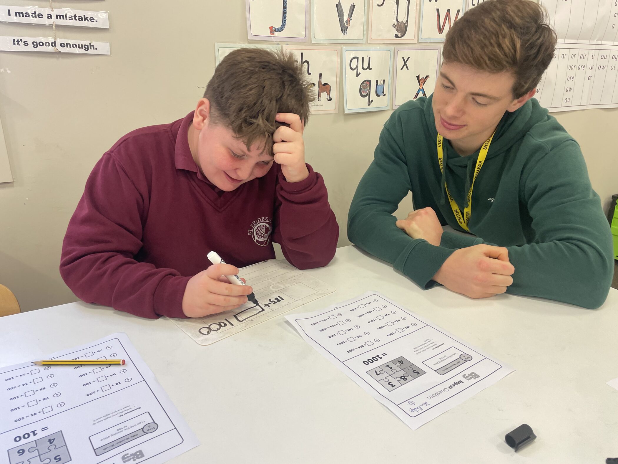 Oscar helps with maths teaching at St Frideswide's school as part of our twinning scheme