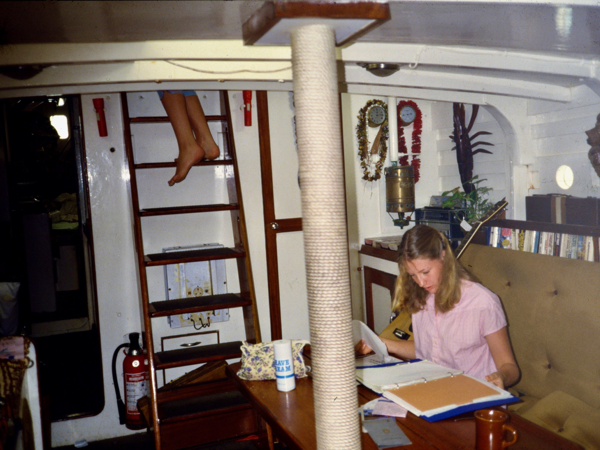 Suzanne attempting to study en route to Fiji in 1985.