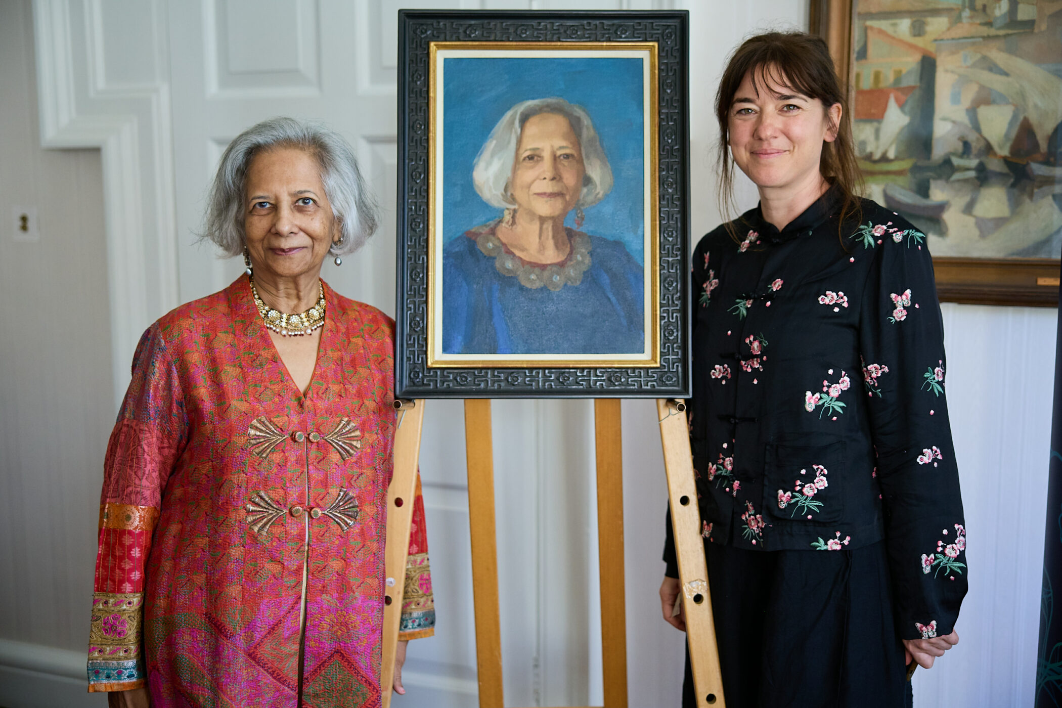 Dr Gita Piramal with artist Rosalie Watkins and the new portrait