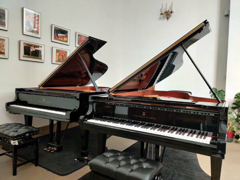 Two Steinways pianos side by side.