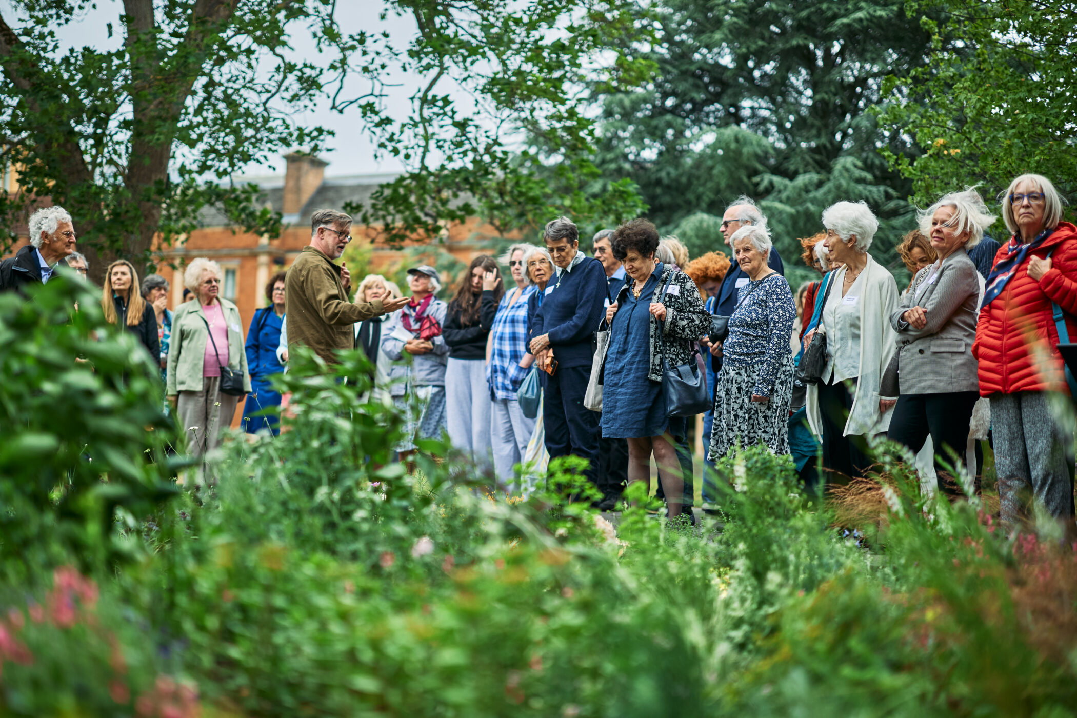 Head Gardener Alastair Mallick takes Penrose Society members on a guided tour of the college gardens back in May
