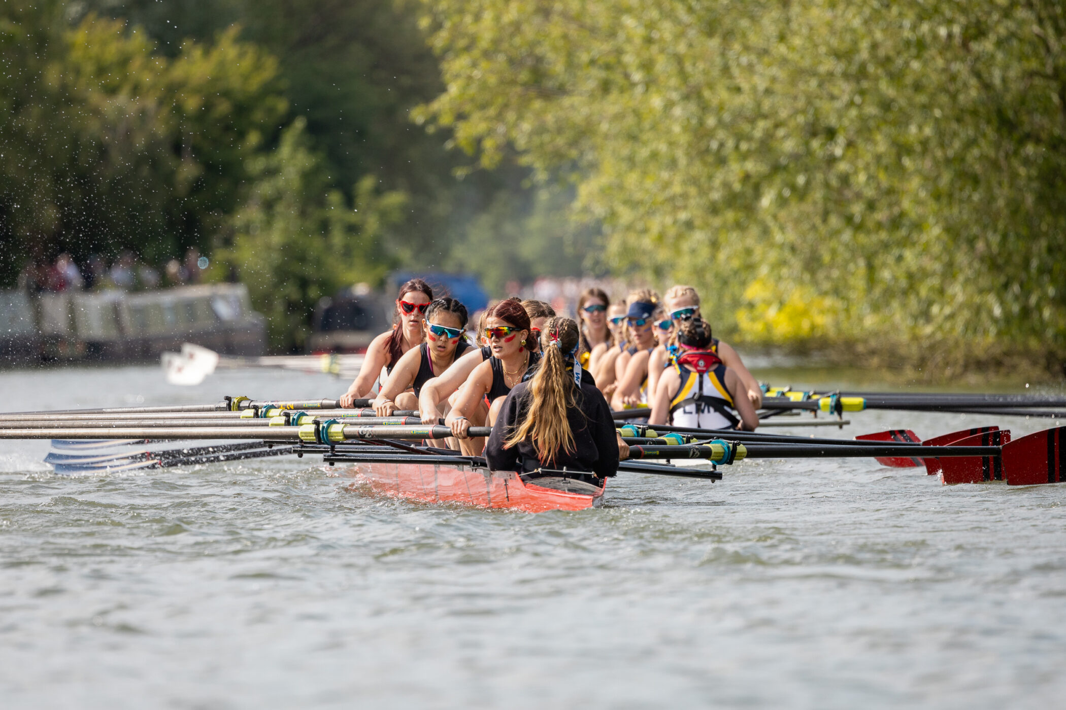 The W1 boat of Somerville College Boat Club gains on its rival at this year's Summer VIIIs