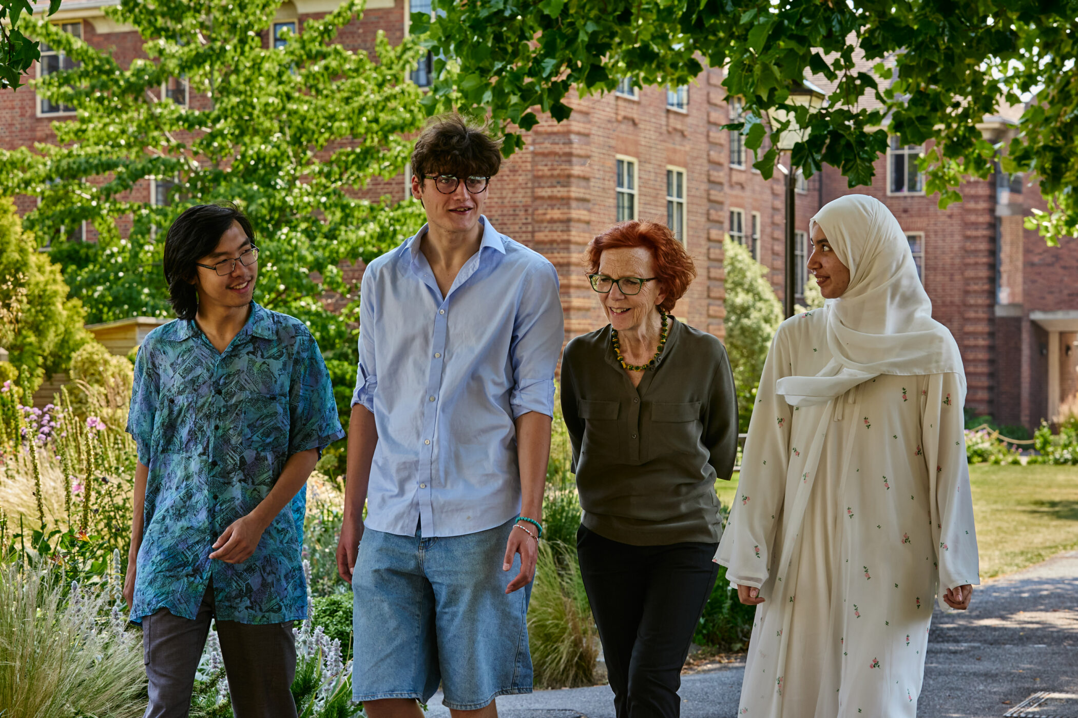 Somerville students Ben, Harry and Mariam, inventors of the award-winning OxGreen app, meet former Principal Jan Royall