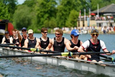 A crew in their boat on the rivet